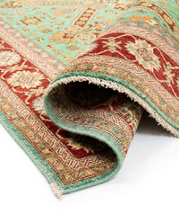 Close-up of Super Kazak mint-green geometric tribal wool rug texture
